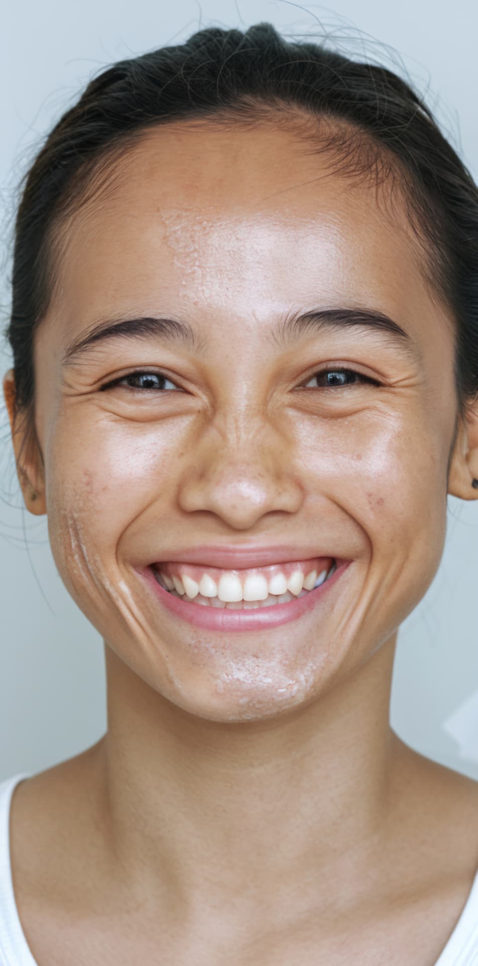 Close-up portrait of an adult with brighter, smoother, more radiant-looking skin